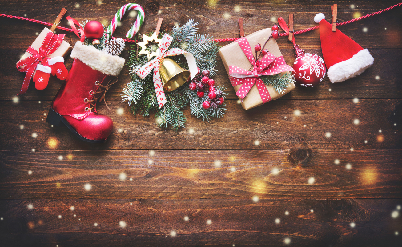 Festive background with Christmas presents, Santas accessories and decoration on the clothesline